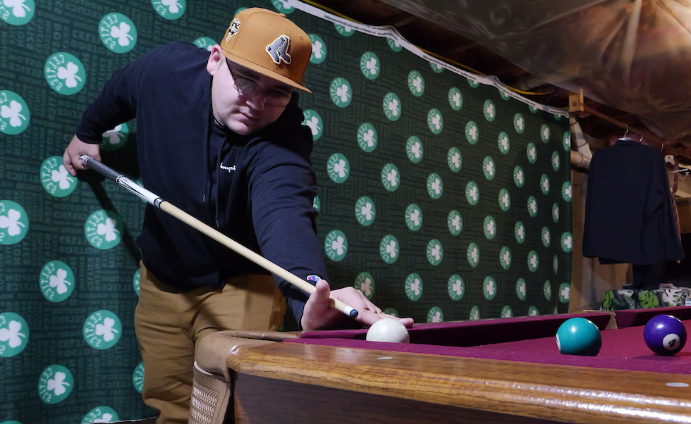 Mike enjoying a game of pool in the Easterseals NH Community-Based Services supportive housing home in the NH seacoast area.