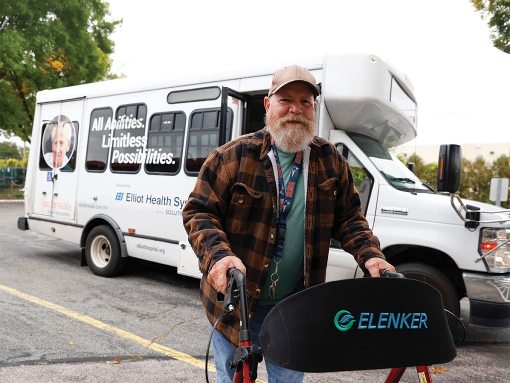 Older man getting off an Easterseals NH bus.