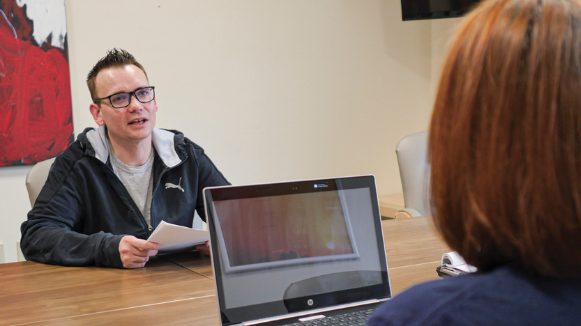 Chris speaks with a care coordinator in our Veterans Count program.